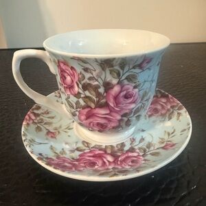 Floral Teacup and Saucer Set red roses pre-owned.
